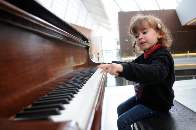 Child playing piano.