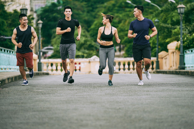 Friends jogging outdoors.