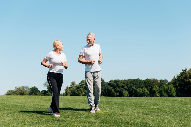 Senior couple taking a walk outside.