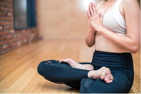 Woman practicing yoga.