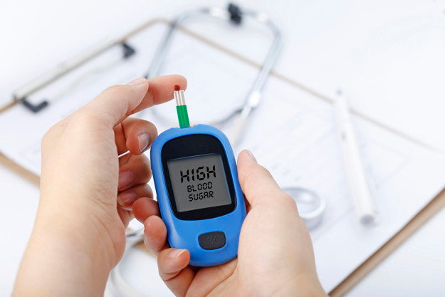 Person using blood glucose meter