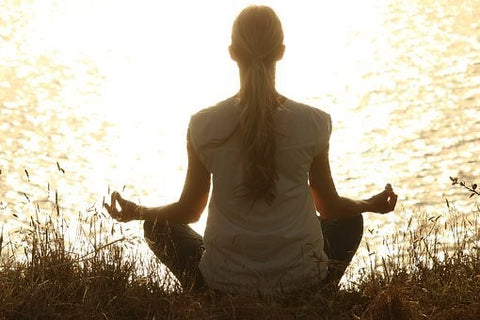 Woman meditating in nature.