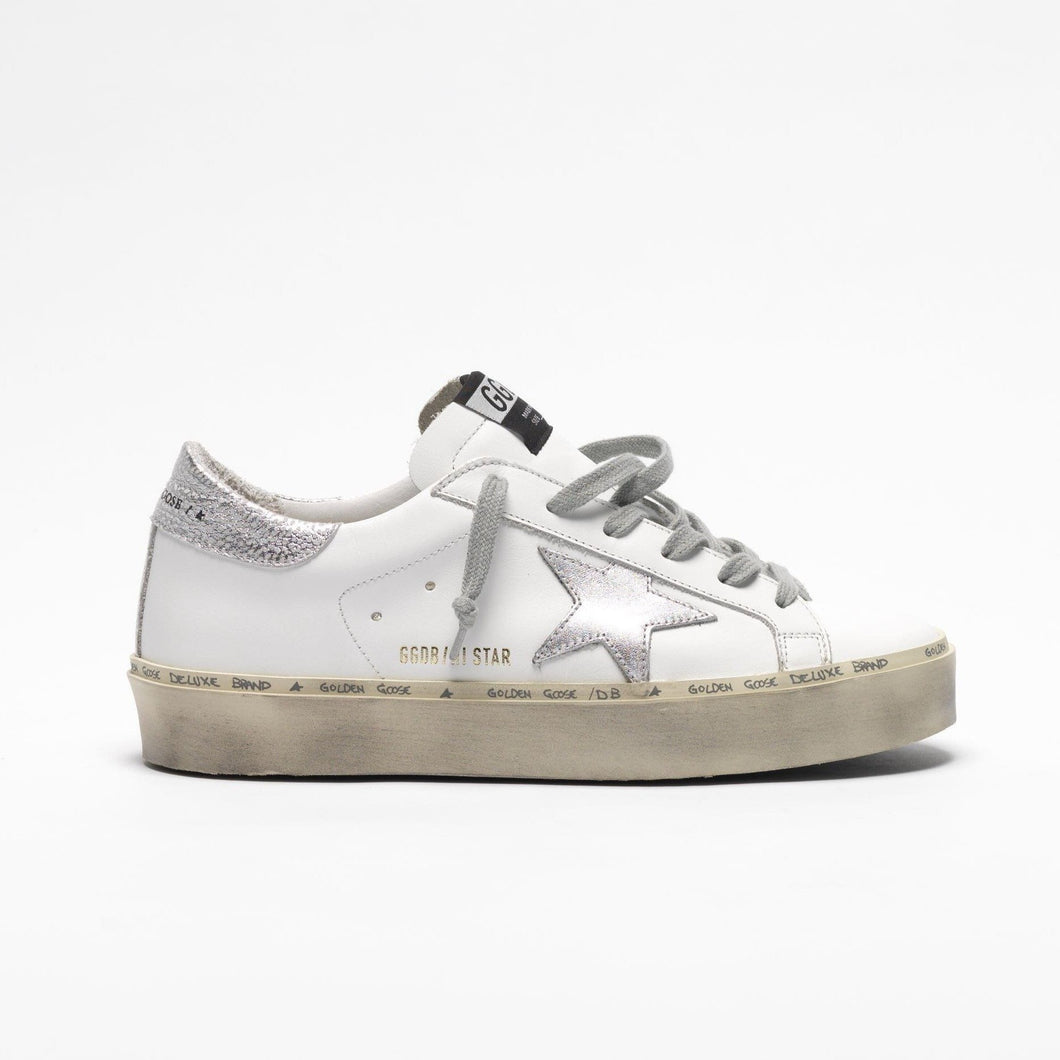 white and silver golden goose