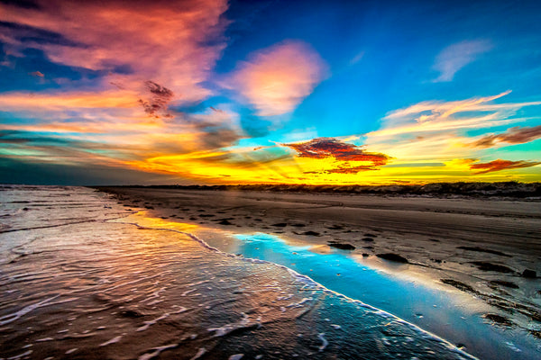 Padre Island National Seashore with a stunning colorful sunset and waves rolling into the shoreline