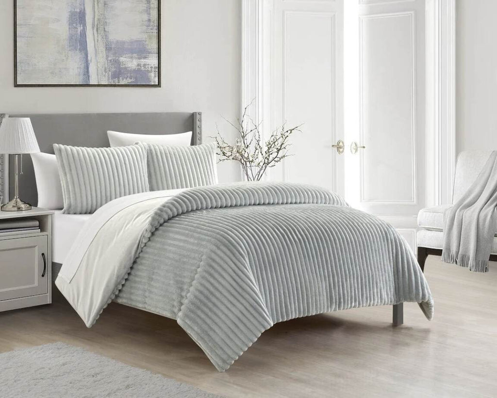 Bed with plush grey comforter set