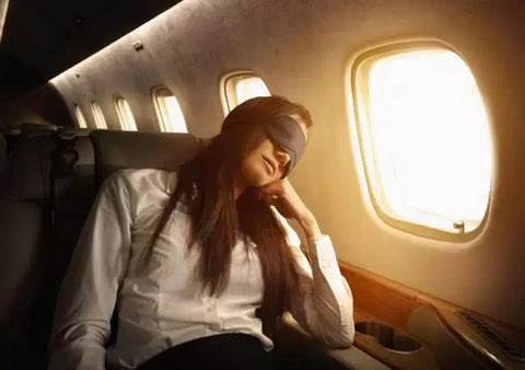 woman sleeping on a plane