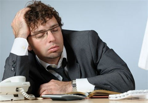 man asleep at his desk