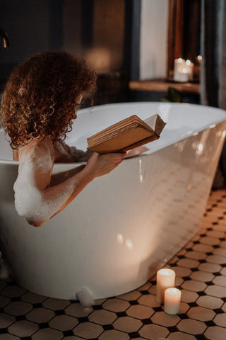 woman in white bathtub