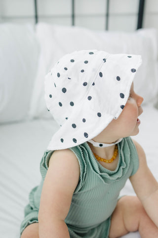 BABY IN SUN HAT FROM BEBE AU LAIT