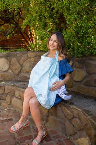 mom nursing baby under a nursing cover