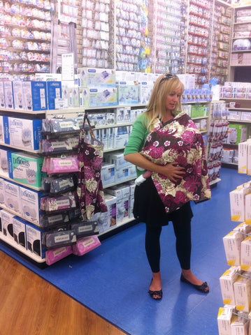 Nursing while checking on our product display in Buy Buy Baby