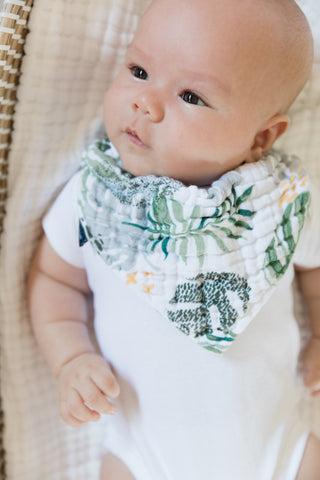 baby wearing a bebe au lait bandana bib