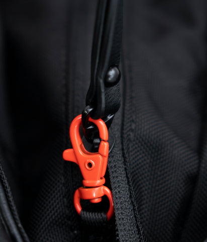 A close up view of the clip lock on the main compartment of Sherpani Anti-Theft bags