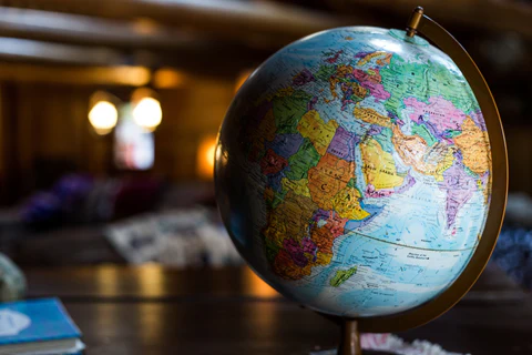 A globe sitting on a desk.