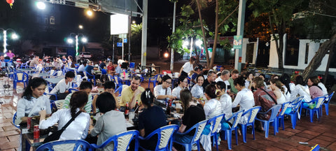 Dining at a community table on the XO Foodie Tour