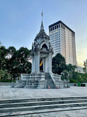 The contrast of a Cambodian temple in the foreground and a skyscraper in the background