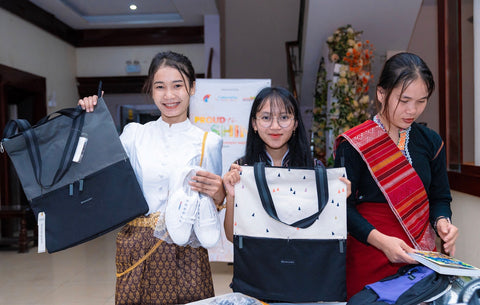Brighter Path Scholarship recipients selecting a Sherpani bag to take to school