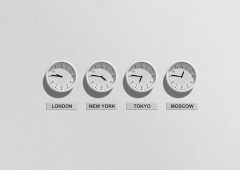 World clocks showing the times in London, New York, Tokyo and Moscow