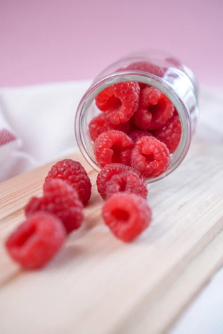 Raspberries in a glass jar