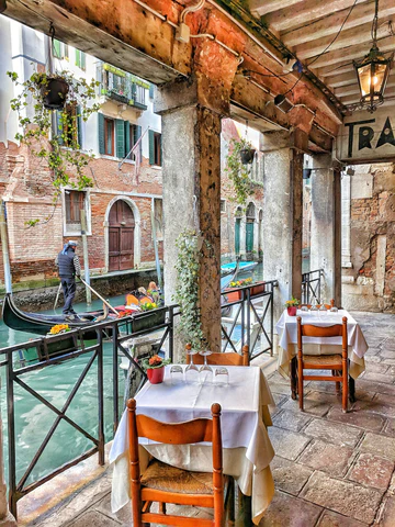 A restaurant patio with a view in Italy