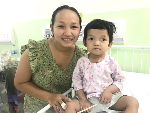 A young Vietnamese girl and her mother at the hospital.