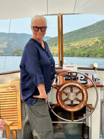 Doni Belau at the helm of her sailboat Relish