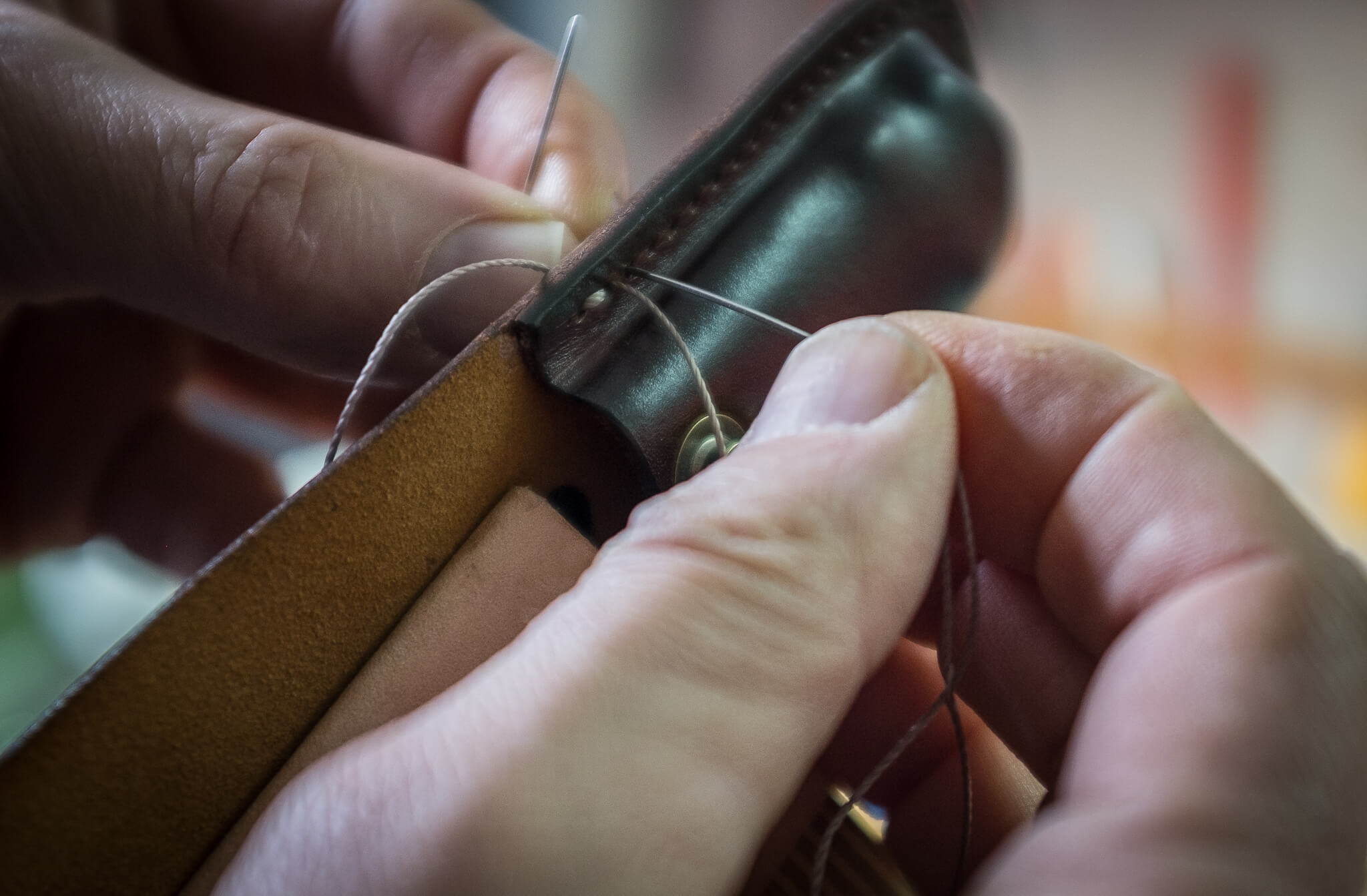 Handstitching the leather knife sheath | Duke & Sons Leather