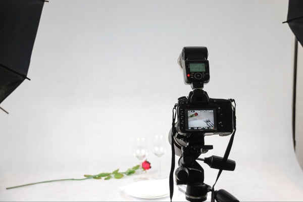 camera taking a photo of a rose