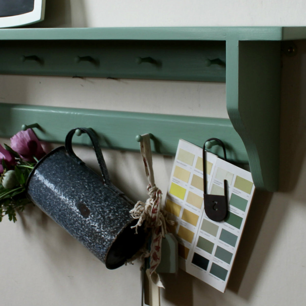 Shelves with hooks, pegs and coat racks