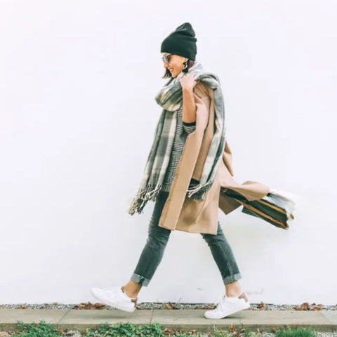 lady wearing full winter gear with wool coat and thick winter scarf