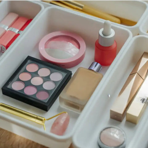 makeup organised in plastic white containers