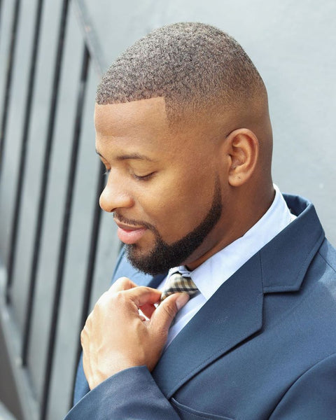 Man with short buzz cut, fade, and groomed beard in dark blue suit and light blue shirt | Style Standard