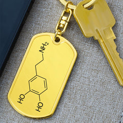 DOSe hormone molecule keychain with gold finish