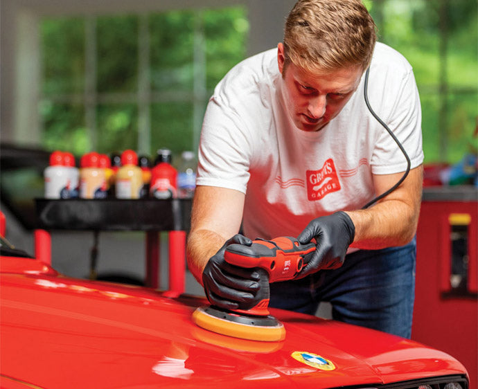 Griot's Garage G9 Orbital Polisher being used to polish the paint on a car