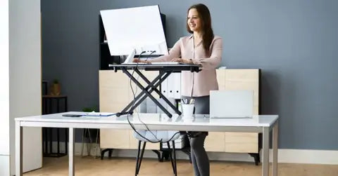 girl working on a stand desk converter