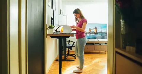 girl working on a fixed standing desk