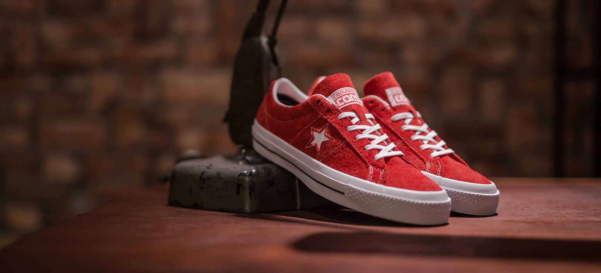 Red suede converse one on sale star