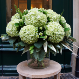 Stunning green Viburnum puff floral arrangement by Bloemen Boutique Botanica, showcasing their innovative and artful design in Amsterdam, Netherlands.
