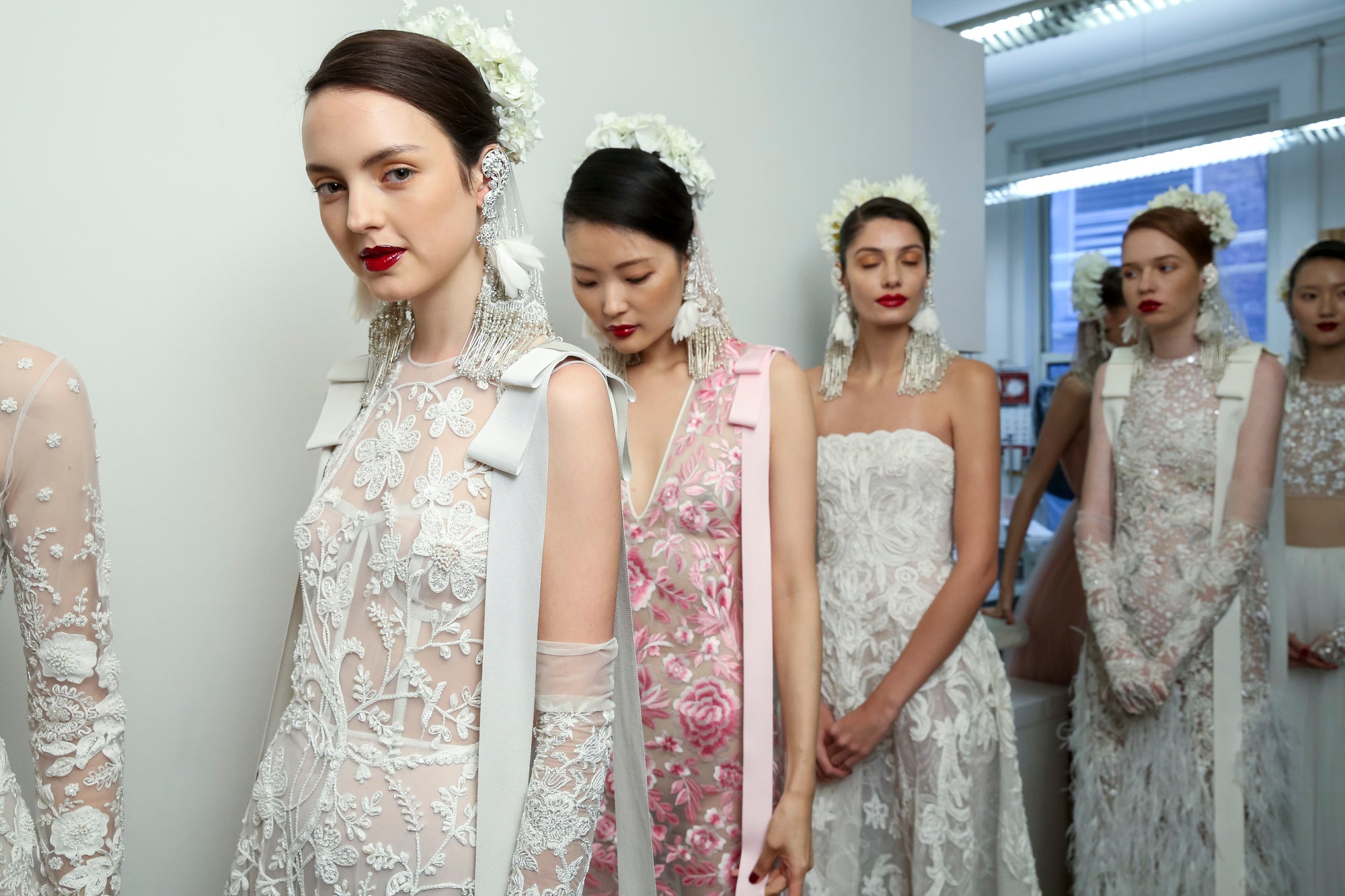 Naeem Khan Bridal models backstage at catwalk show.