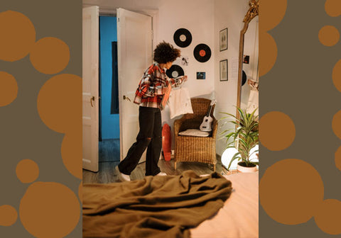 teen with records on the wall