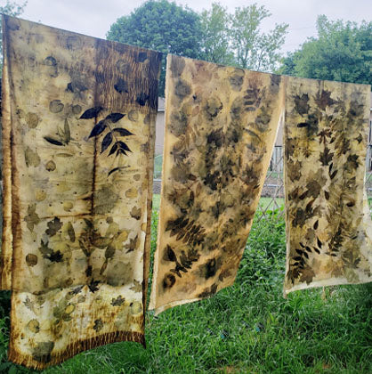 Freshly dyed and washed leaf print fabric hanging to dry.  These pieces were turned into throw pillows.