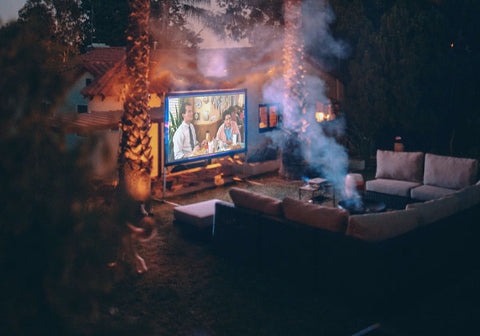 Outdoor firepit, couch and TV