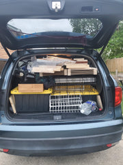 My SUV, filled to the brim with totes and displays.