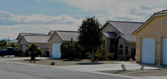 Drought affecting front lawn houses.