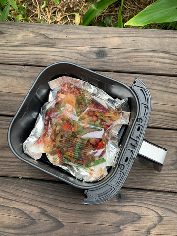 food in cooking bag inside air fryer