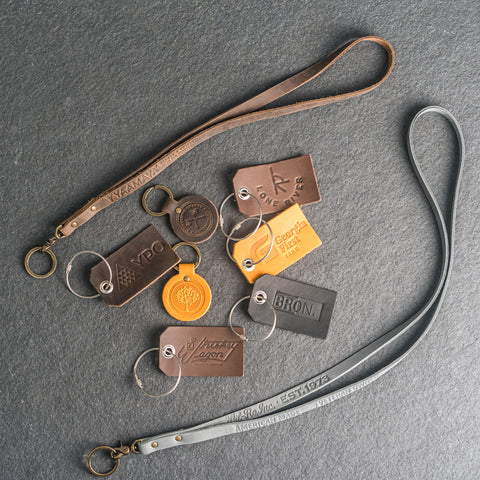 Logo stamped on leather lanyards, leather keychains, and leather luggage tags - Corporate gifting by Ox & Pine Leather Goods