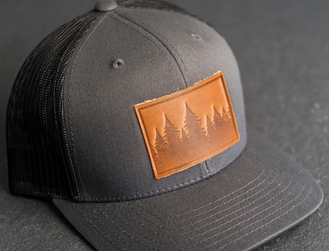 Leather Patch Trucker Style Hat - Pine Tree Ridgeline Design Patch Stamp