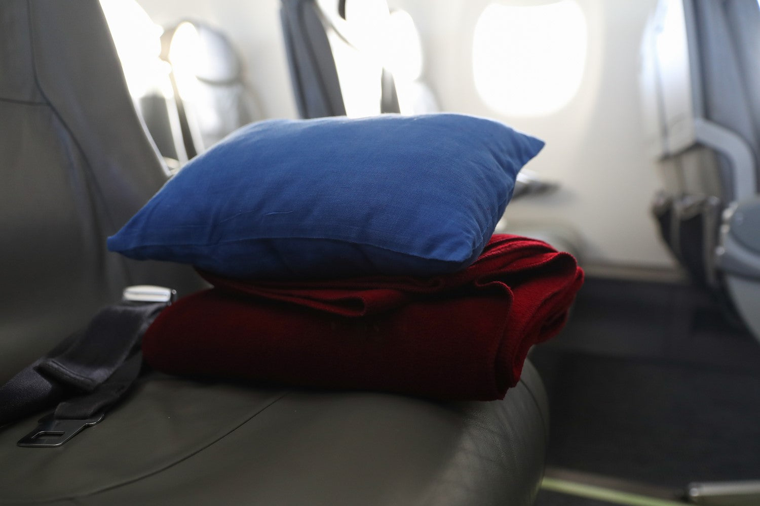 travel pillows laying on airplane seat