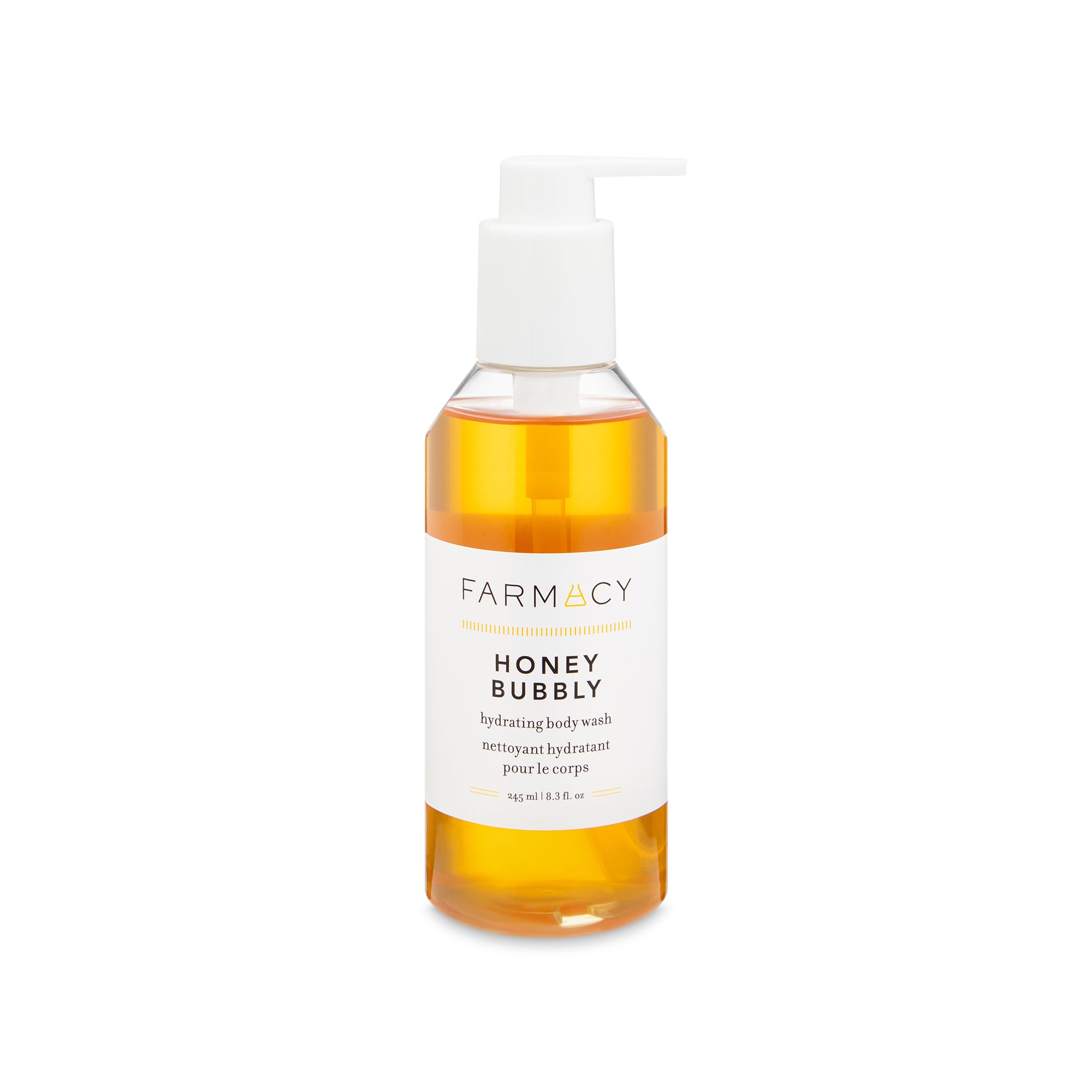 A bottle of Farmacy's Honey Bubbly body wash with shadow