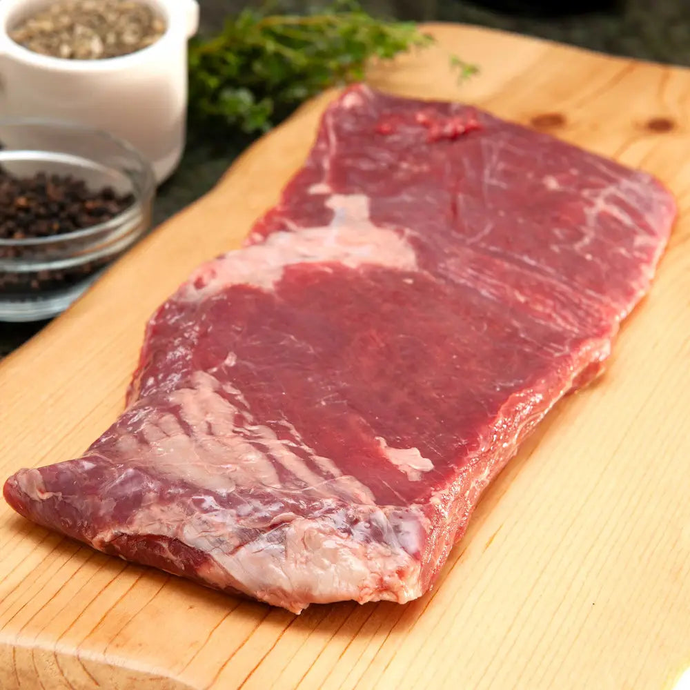 raw flank steak for carne asada